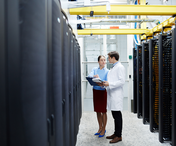 Two people in a data center